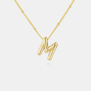 Gold initial M charm necklace with beaded chain