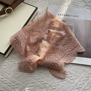 Pink delicate floral lace scarf with scalloped edges.