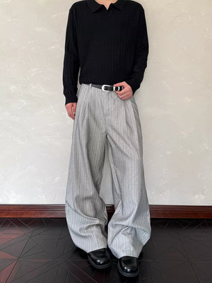 Relaxed wide-leg sweatpants in light grey with vertical pinstripes and a comfortable fit.
