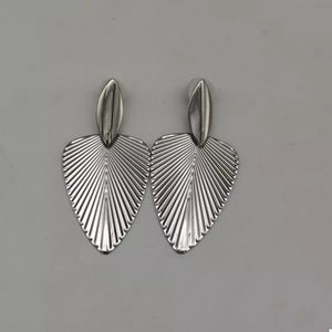 Silver leaf silhouette dangle earrings with ribbed texture