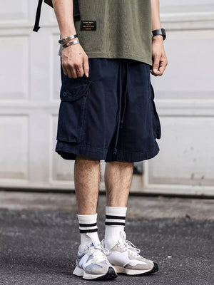 Navy blue cargo shorts with drawstring and flap pockets.