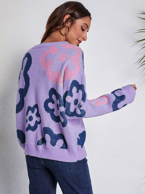 Lavender acrylic knit crewneck sweater with a bold floral pattern in navy and pink.