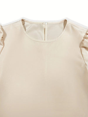 Beige cropped puff-sleeve top with round neckline and back zipper detail.