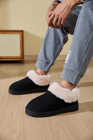 Black suede slippers with plush shearling trim, cozy house shoes for men and women.
