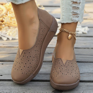 Brown floral cutout slip-on loafers with breathable design.