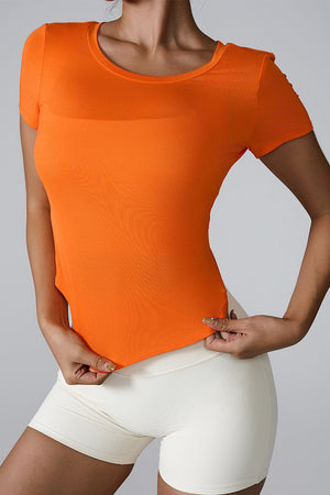 Orange active tee with short sleeves and a round neckline, featuring a subtle sheer panel at the chest.