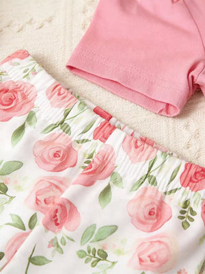 Pink ruffle top and white floral pants set for baby girls.
