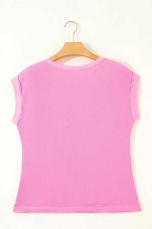 Pink waffled seam pocketed casual t-shirt with short sleeves and a crew neck.