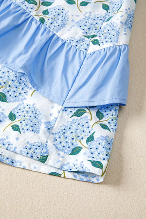 Midi dress with blue hydrangea print, flutter sleeves, and ruffled detail.