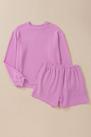 Ribbed knit matching set with crewneck long sleeve top and elastic waist shorts in pink.