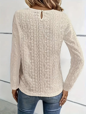 White eyelet embroidered blouse with lace yoke detail and keyhole back.