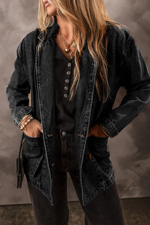 Dark denim double-breasted blazer with button front and flap pockets.