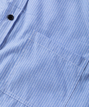 Light blue button-down shirt with white pinstripes and a chest pocket.