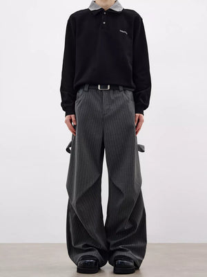 Men's charcoal pinstripe wide-leg sweatpants with pockets and adjustable straps.