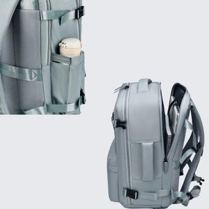 Travel backpack in Air Force Blue with side water bottle pocket and open main compartment showing laptop.