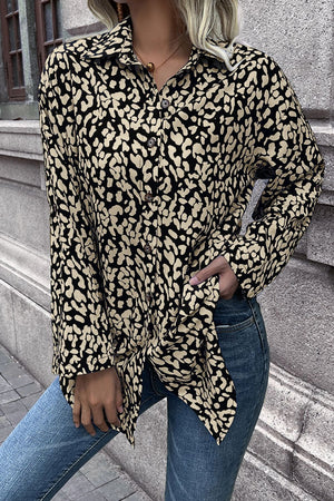 Women's black and beige abstract spot print oversized button-up shirt with collar.
