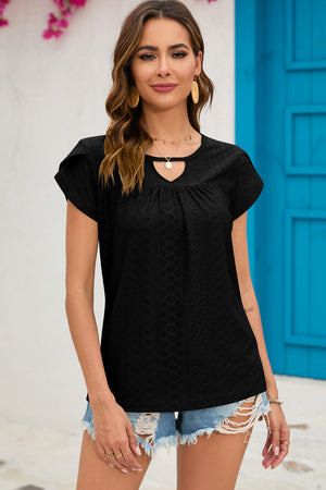 Black eyelet cap-sleeve top with keyhole neckline and ruffled sleeves.