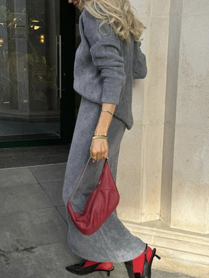 Textured knit co-ord set in dark gray, featuring a relaxed silhouette sweater and wide-leg pants.