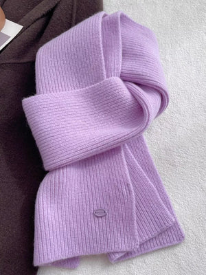 Lavender purple ribbed knit wool scarf with a subtle oval logo detail.
