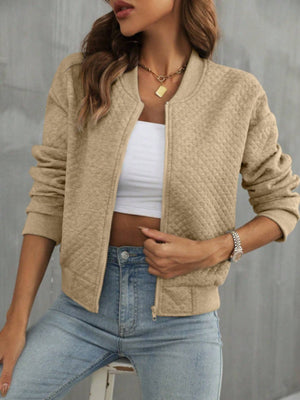 Camel diamond quilted bomber jacket with zip front and ribbed cuffs.