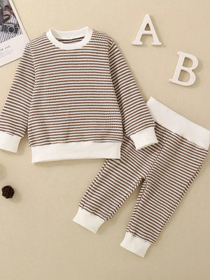 Baby knit set with brown and white stripes, long sleeves, crewneck, and matching pants.