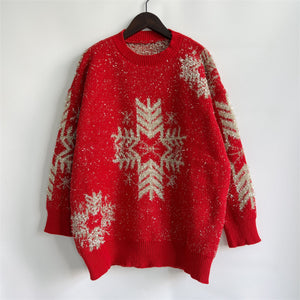 Red acrylic sweater with silver snowflake embellishments and metallic threads.