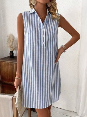 Light blue and white striped collared sleeveless shirt dress with button detail.