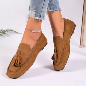 Brown suede slip-on loafers with tassel detail and square toe