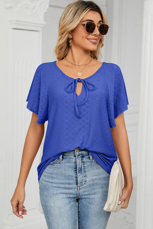 Blue eyelet tie-neck flutter sleeve blouse with open knit detail.