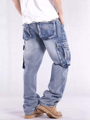 Relaxed fit light wash denim cargo jeans with flap pockets and contrast stitching.