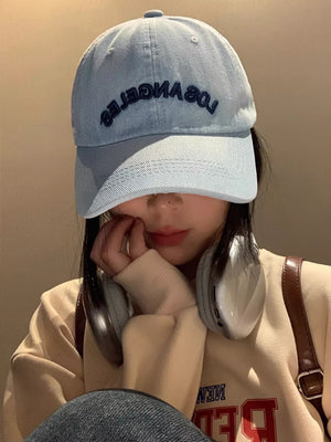 Dark blue embroidered denim baseball cap with adjustable strap