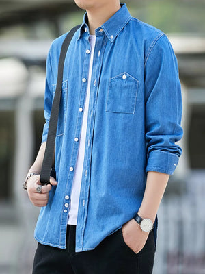 Sky blue 100% cotton denim shirt with dual chest pockets and button-down collar.