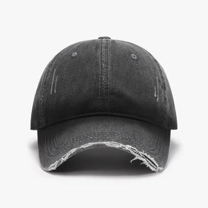 Faded denim baseball cap in dark gray with distressed details and frayed brim.