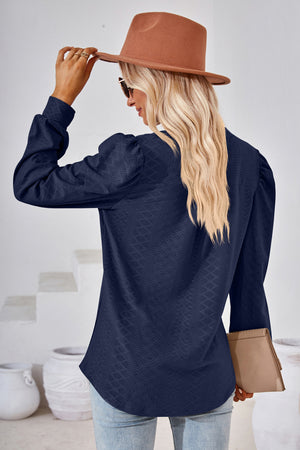 Dark blue textured bishop sleeve blouse with subtle diamond pattern