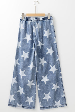 Cosmic Wash Star Print Palazzo Jeans in medium wash denim with white stars and an elastic waistband.