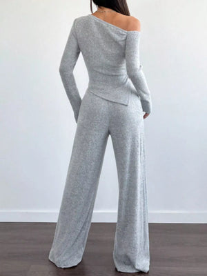 Light gray ribbed knit one-shoulder top and wide-leg pants set.