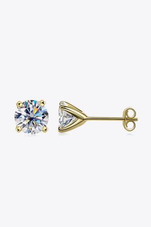 Gold moissanite solitaire stud earrings with sculpted setting.