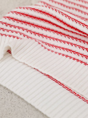 White knit shell top with horizontal red stripes and ribbed texture.
