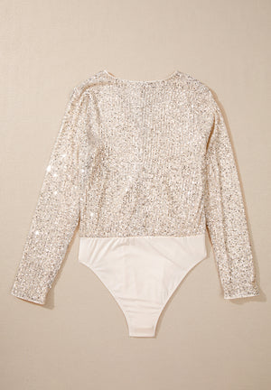 Ivory sequin long sleeve bodysuit with a deep V-neck and a smooth bottom.