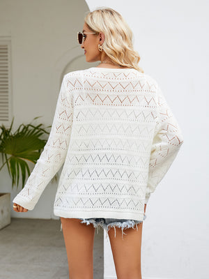 White openwork knit crewneck pullover sweater with diamond pattern detail.