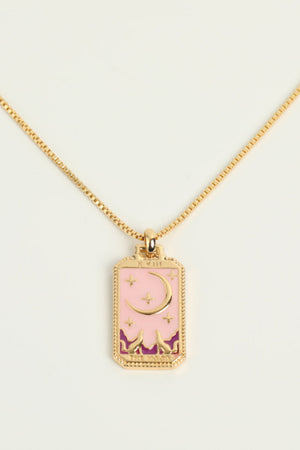 Celestial tarot pendant necklace in gold with pink enamel, moon and stars design.