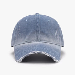 Faded denim baseball cap in Dusty Blue with distressed details and frayed brim.