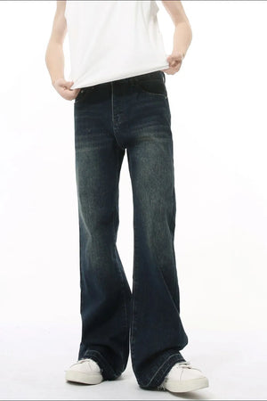 Dark wash flare jeans with vintage fading and a relaxed fit.