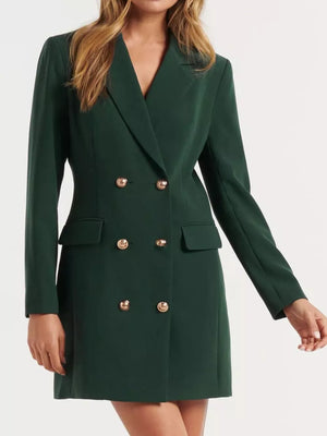 Dark green tailored double-breasted blazer dress with gold buttons and flap pockets.