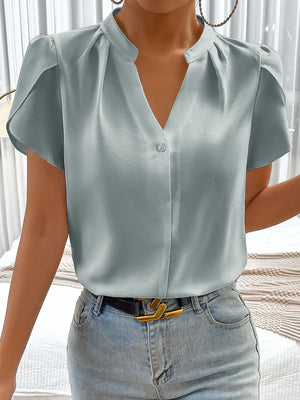 Light blue satin blouse with notched neckline, petal sleeves, and button detail.