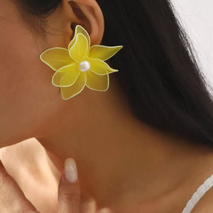 Yellow floral stud earrings with pearl center, mesh petals and alloy backing.