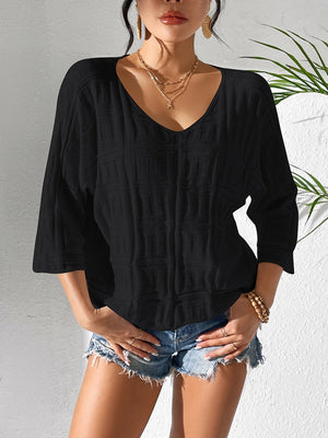 Black textured knit dolman sleeve top with V-neck and 3/4 sleeves.