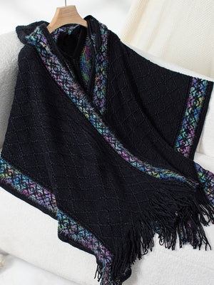 Black acrylic knit hooded wrap coat with colorful embroidered trim and fringe.