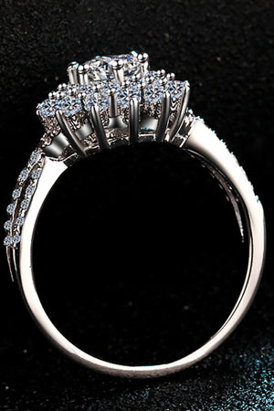 Silver ring with halo of moissanite stones and pave band.