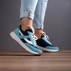 Iridescent panel mesh runners in navy and light blue with white accents and laces.